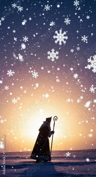Fototapeta St. Nicholas with staff walking in snowy landscape at sunset  