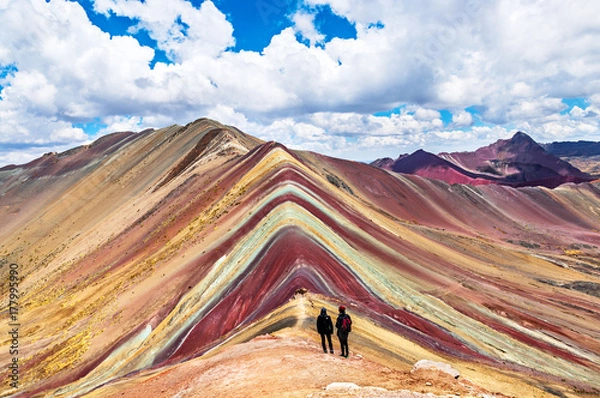 Fototapeta Tourists couple stand and look afar at Rainbow Mountains, Cusco, Peru