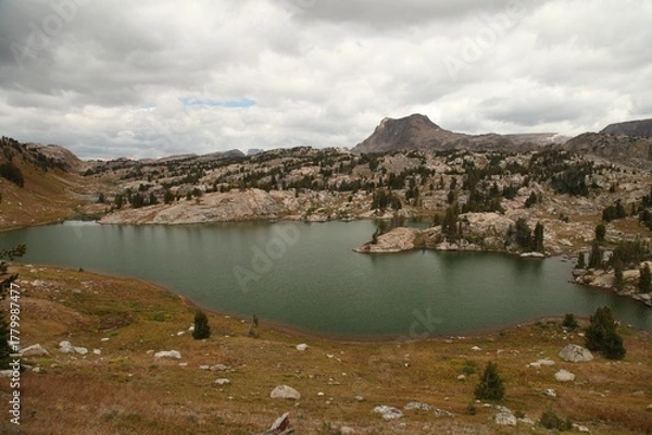 Fototapeta Alpine lake in Beartooth Mountains, Wyoming with view into Montana