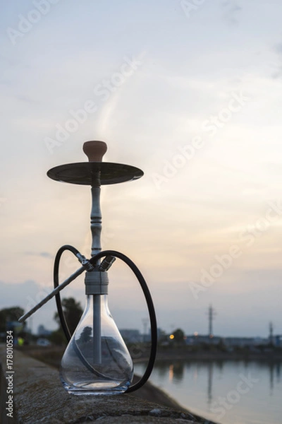 Obraz Metallic shisha in the sunset background