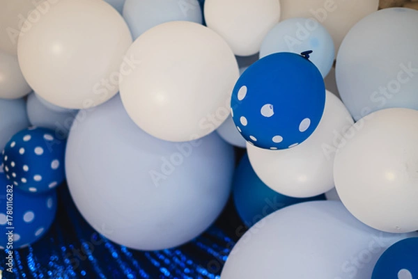 Fototapeta Soft blue, dotted navy and white balloons for party and celebration