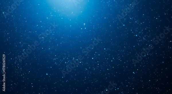 Fototapeta Abstract blue background with glowing particles and light effect