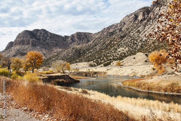 Fototapeta Fisherman in the Wind River Canyon Scenic Byway in Autumn in Central Wyoming.