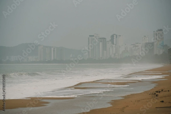 Fototapeta waves breaking on Nha Trang beach before the Kalmaegi storm