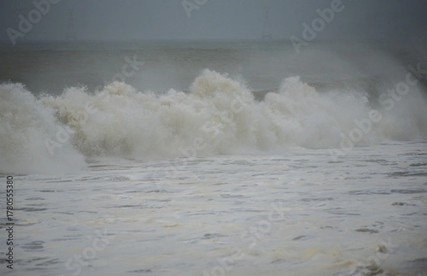 Obraz waves breaking on Nha Trang beach before the Kalmaegi storm