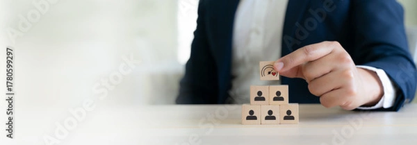 Fototapeta Soft Skills and Leadership concept. Building a team with emotional intelligence. Wooden blocks with emotional intelligence performance icon. Soft skills, leadership and empathy in workplace.