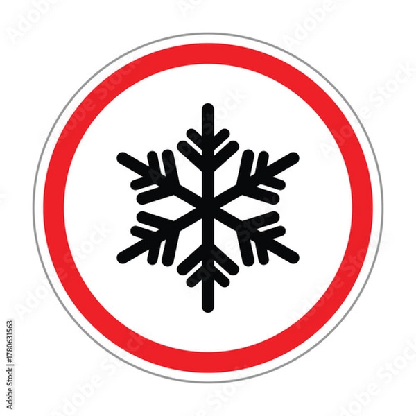 Obraz Circular warning sign with a black snowflake icon inside a red border on a white background. Symbol represents icy or cold conditions, frost warning, winter hazard, and safety alert.