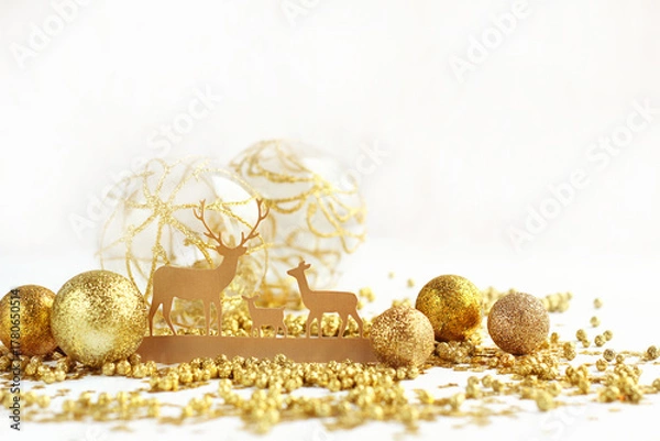 Fototapeta christmas toy deer family and festive golden decoration. winter festive composition. New year, Christmas, Advent holidays concept. magic atmosphere, fairytale