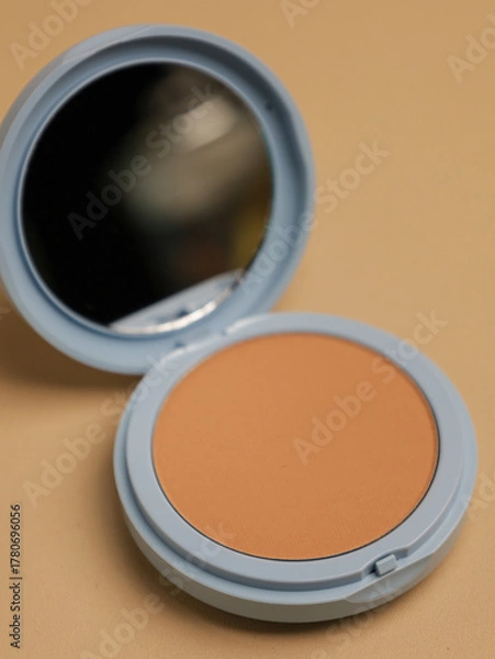 Fototapeta Compact pressed powder with mirror in blue container
