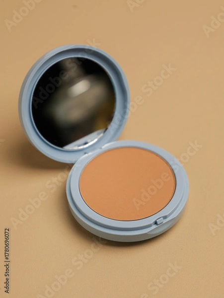 Fototapeta Compact pressed powder with mirror in blue container