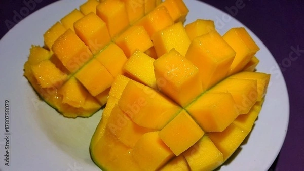 Fototapeta Fresh ripe mango slices served on a plate 