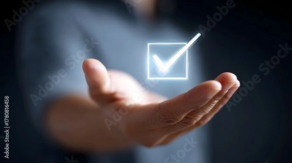 Fototapeta Conceptual image of an outstretched palm offering a luminous checkmark icon representing successful task completion verification choice and positive outcomes in technology or business