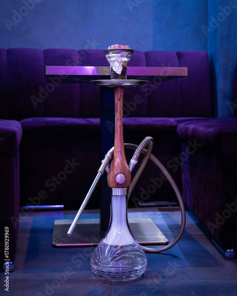 Fototapeta Full hookah on table in lounge bar — modern interior with blue lighting and elegant sofas