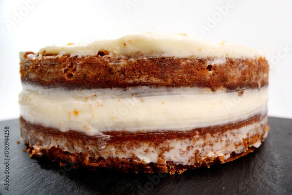 Fototapeta Carrot cake layers with cream cheese frosting