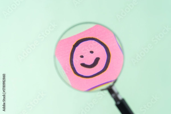 Obraz Magnifying glass show the smile emoji