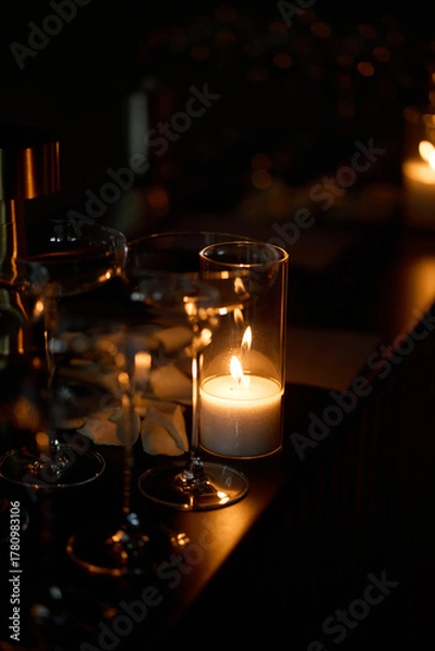 Fototapeta Empty clear glasses in the candlelight