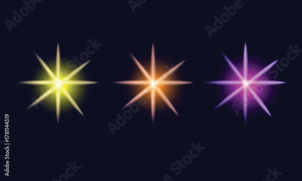 Obraz Three Glowing Starbursts In Yellow Orange And Purple light sparkle