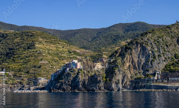 Obraz Panoramic view of the Ligurian coast and the colorful villages of Cinque Terre as seen from the sea on a cruise ship on a clear day. Cinque Terre, Liguria, Italy