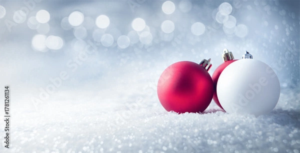 Obraz Red and white christmas balls on white snow background with copy space