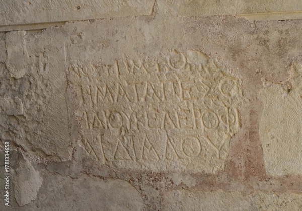 Obraz Antique writing on the wall in Church of St. Nicholas, holy places and landmarks of Demre in Turkey.