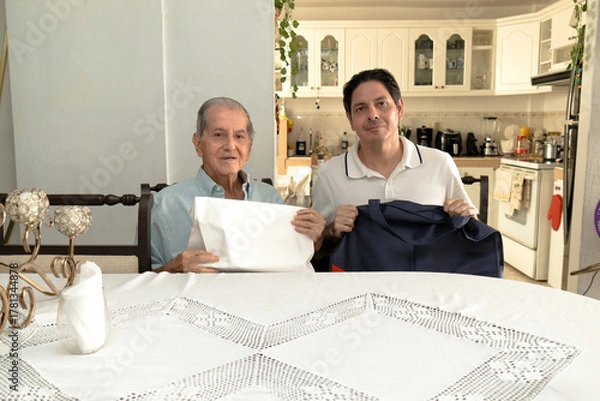 Obraz Father and son of Latin descent enjoying shopping together