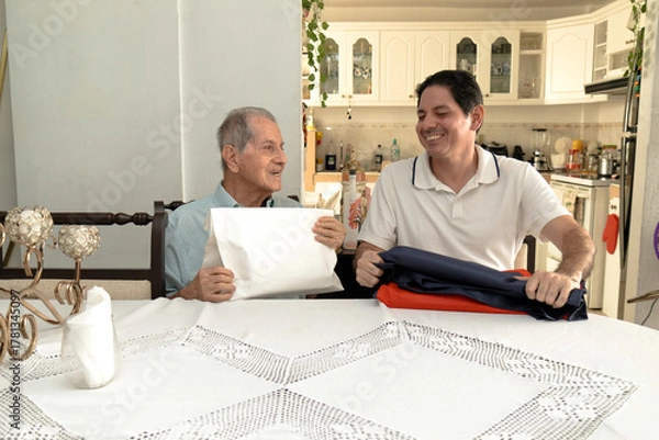 Obraz Father and son of Latin descent enjoying shopping together