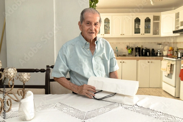 Obraz Latino senior citizen with a white shopping bag