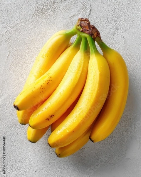 Obraz Fresh and Ripe Bananas on White Textured Background for Food Photos