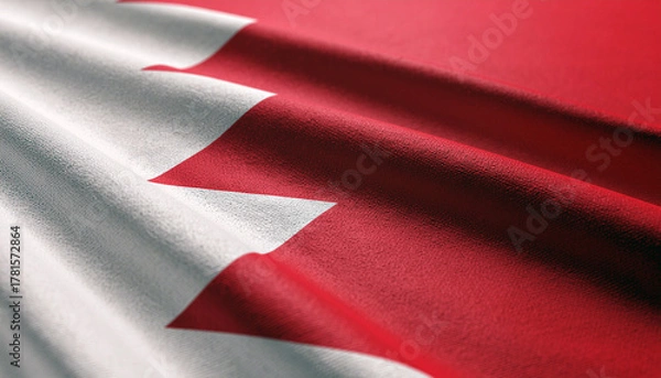 Fototapeta Bahrain's vibrant national flag waving gently, embodying patriotism and national pride in a close-up, textural display of red and white