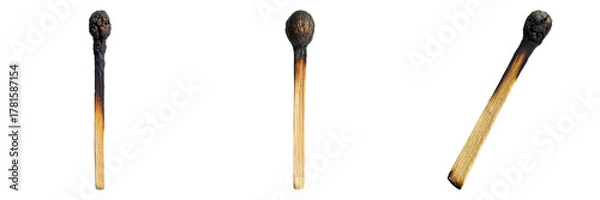 Obraz A close-up shot of three burnt matchsticks showing different stages of burning. The charred remains and smoky tips evoke a sense of finality