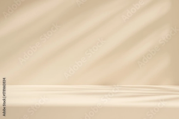 Fototapeta Soft beige studio background with diagonal shadow patterns and a subtle foreground platform