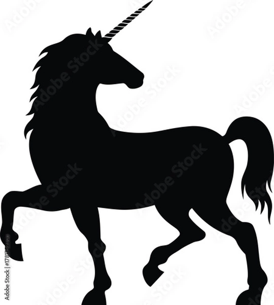Fototapeta Silhouette of a majestic unicorn standing with one leg raised in a magical fantasy setting