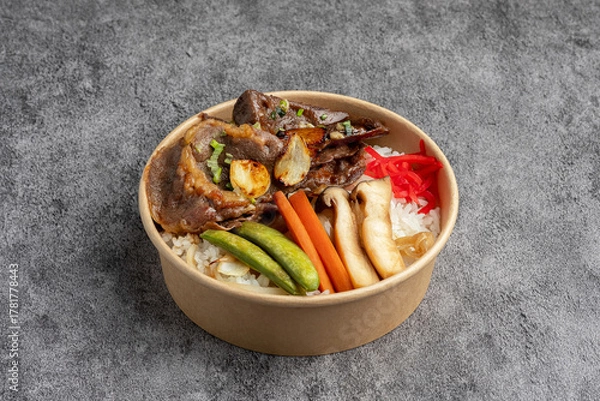 Fototapeta Japanese Beef Gyudon or Yakiniku Rice Bowl in Takeout Container