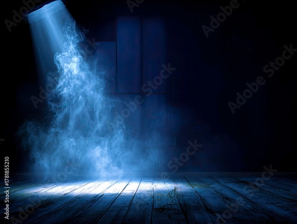 Fototapeta Atmospheric blue spotlight illuminates smoke and dark textured floor.