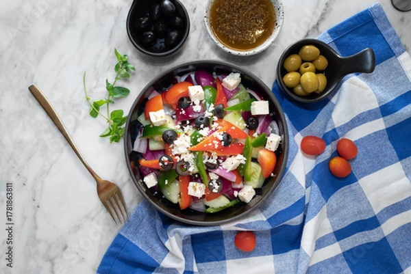 Fototapeta A vibrant overhead shot of a fresh Greek salad with various ingredients