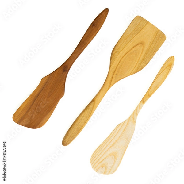 Obraz Three wooden kitchen spatulas on a white background

