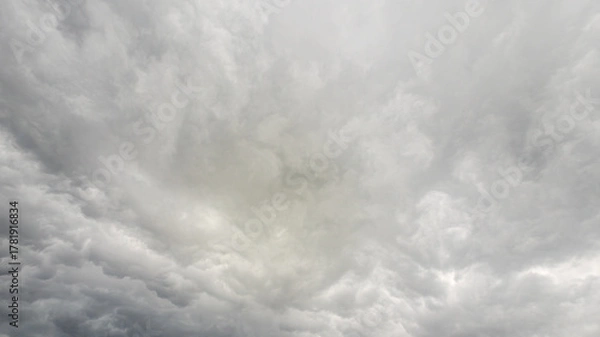 Fototapeta Dark, heavy gray cloud background with clear copy space for text and graphics.