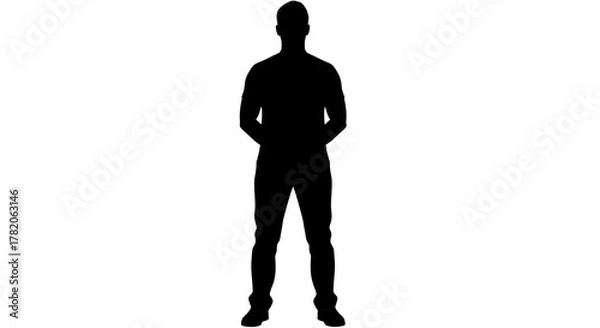Fototapeta Silhouette of a man standing with his hands behind his back against a white background in full shot