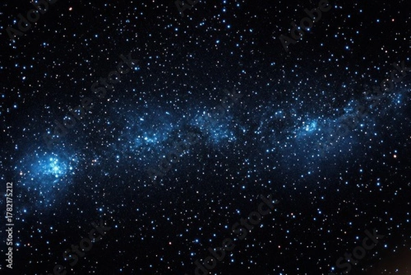 Obraz Vast starry night sky with dense clusters of bright stars and a visible blue-hued galaxy band stretching horizontally