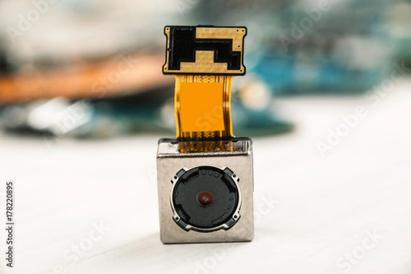 Fototapeta Smartphone camera module on a white background, closeup