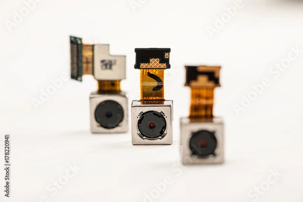 Fototapeta Smartphone camera modules on a white background, closeup