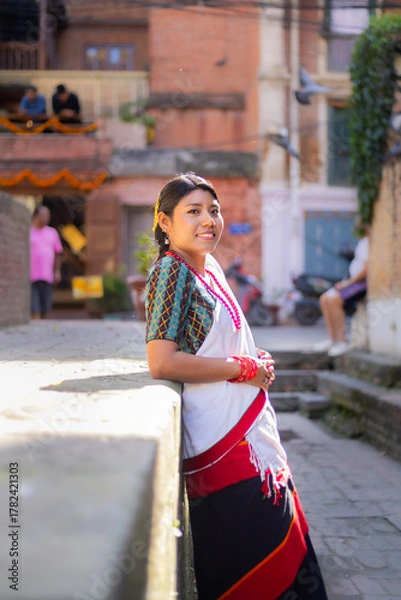 Obraz Newari Girl in Traditional Attire Strolling Through Patan Durbar Square