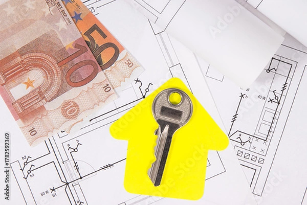 Fototapeta Euro banknotes, diagrams of electric installation, key and shape of house. Planning build or buy of home