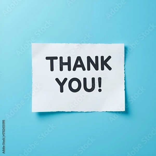 Fototapeta White paper speech bubble with teal Thank You message on blue background

