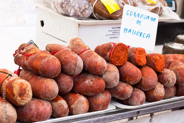 Obraz Traditional Majorcan Sobrassada sausage (Sobrasada de Mallorca) for sale in the stall of Sineu market, Mallorca, Spain