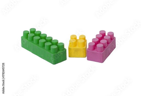 Fototapeta Three Colorful Plastic Construction Blocks on Transparent Background