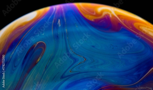 Fototapeta closeup photo of colored light reflection on the surface of soap bubble