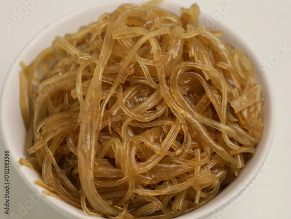 Fototapeta Stir fried glass noodles in white bowl