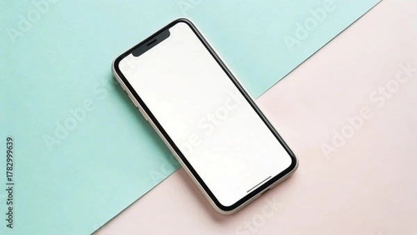 Fototapeta Modern smartphone mockup with blank screen on a minimal pastel pink and mint green split background.