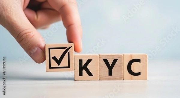 Fototapeta Hand placing a checkmark on a wooden block, completing the kyc process, representing identity verification and customer onboarding